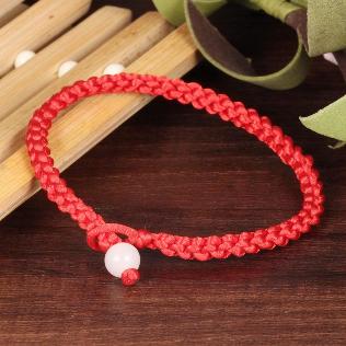 Bracelet made of red yarn