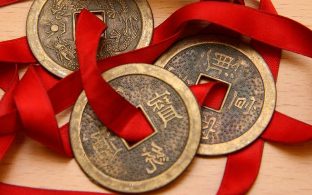 Chinese coins with a red ribbon